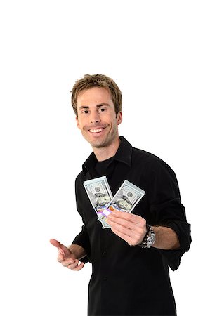 simsearch:700-02265003,k - A young handsome man holding a lot of new hundred dollar bills isolated on white background.  This newly redesigned US currency was released for circulation in October of 2013. Stock Photo - Budget Royalty-Free & Subscription, Code: 400-07250651