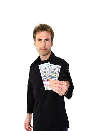 simsearch:700-02265003,k - A young handsome man holding a lot of new hundred dollar bills isolated on white background.  This newly redesigned US currency was released for circulation in October of 2013. Stock Photo - Budget Royalty-Free & Subscription, Code: 400-07250652