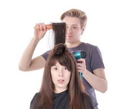simsearch:640-01645805,k - Woman enjoying having her hair blow dried, isolated on white Photographie de stock - Aubaine LD & Abonnement, Code: 400-07250893