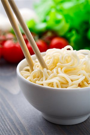 Noodles in a bowl on a wooden table Stock Photo - Budget Royalty-Free & Subscription, Code: 400-07251464