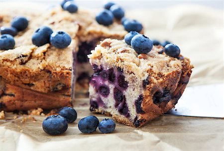 simsearch:400-07295671,k - Piece of homemade blueberry cake with berries around, close up Photographie de stock - Aubaine LD & Abonnement, Code: 400-07251487