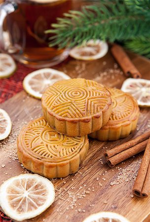 Moon cakes and tea with lemon and cinnamon around. Chinese mid autumn festival food. Stock Photo - Budget Royalty-Free & Subscription, Code: 400-07251489