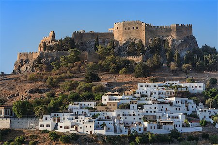 Lindos with the castle above on the Greek Island of Rhodes Stock Photo - Budget Royalty-Free & Subscription, Code: 400-07251502