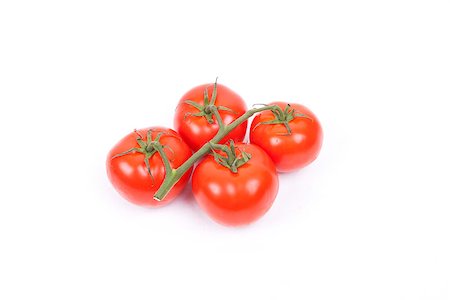 tomatos on a vine isolated on a white background Foto de stock - Super Valor sin royalties y Suscripción, Código: 400-07251645