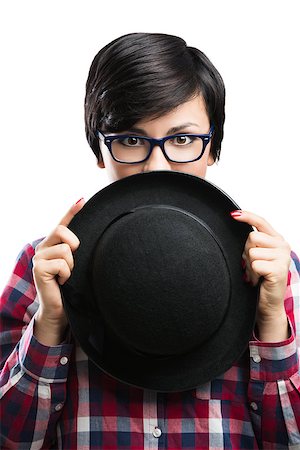 Beautiful girl with a funny face wearing a hat and nerd glasses, isolated over white background Stock Photo - Budget Royalty-Free & Subscription, Code: 400-07252305