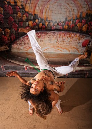 Capoeira performers practicing back shoulder throwing indoors Foto de stock - Super Valor sin royalties y Suscripción, Código: 400-07252374