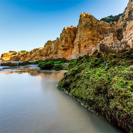 Green Stones at Porto de Mos Beach in Lagos, Algarve, Portugal Stock Photo - Budget Royalty-Free & Subscription, Code: 400-07252506