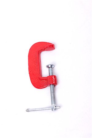 Red clamp isolated on a white background Foto de stock - Super Valor sin royalties y Suscripción, Código: 400-07252835