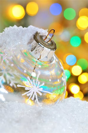 simsearch:400-05674130,k - Transparent Christmas ball on snowy winter and yellow lights Photographie de stock - Aubaine LD & Abonnement, Code: 400-07252960