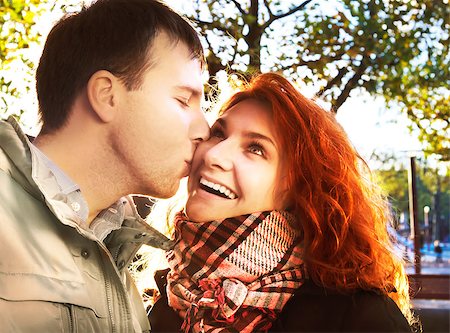 Outdoor happy couple in love posing against autumn Amsterdam background Stockbilder - Microstock & Abonnement, Bildnummer: 400-07252974