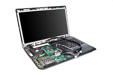 disassemble - Laptop half disassembled with stethoscope on it Stock Photo - Budget Royalty-Free & Subscription, Code: 400-07253014