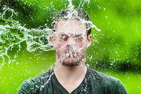 Young Adult That Got Completely Drenched with Green Background Photographie de stock - Aubaine LD & Abonnement, Code: 400-07253215