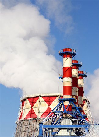 simsearch:400-04231682,k - Smoking pipes of gas-turbine plant against blue sky Photographie de stock - Aubaine LD & Abonnement, Code: 400-07264273