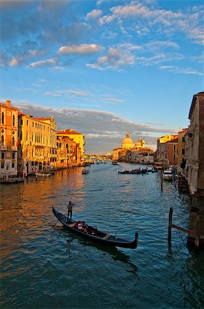 simsearch:400-07272498,k - Venice Italy grand canal view from the top of Accademia bridge with "Madonna della Salute" church on background at sunset Stock Photo - Budget Royalty-Free & Subscription, Code: 400-07264556