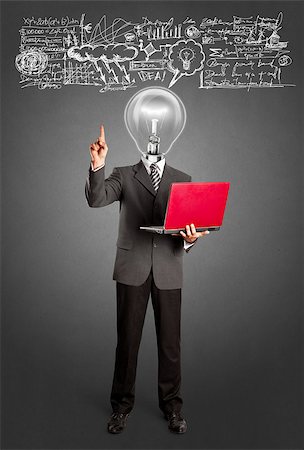 symbol present - Idea concept. Lamp head business man shows something with his finger Foto de stock - Super Valor sin royalties y Suscripción, Código: 400-07265497