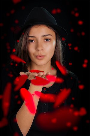 simsearch:400-04834980,k - Beautiful girl blowing kisses and heart shaped petals at the viewer. Stock Photo - Budget Royalty-Free & Subscription, Code: 400-07266126
