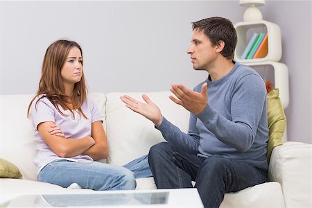 simsearch:400-05739935,k - Angry couple having an argument in their living room at home Stock Photo - Budget Royalty-Free & Subscription, Code: 400-07266800