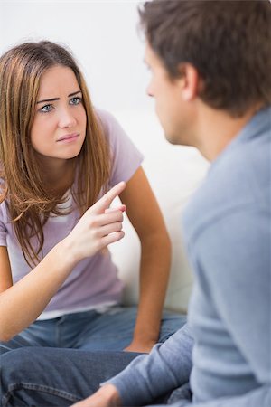 simsearch:400-05739935,k - Angry young couple having an argument in their living room at home Stock Photo - Budget Royalty-Free & Subscription, Code: 400-07266802