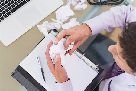 simsearch:400-07931035,k - Overhead view of a cropped young businessman with laptop, diary and crumpled papers at office desk Stock Photo - Budget Royalty-Free & Subscription, Code: 400-07266947