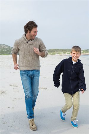 simsearch:400-07267212,k - Full length of a young man and son jogging at the beach Stockbilder - Microstock & Abonnement, Bildnummer: 400-07267120