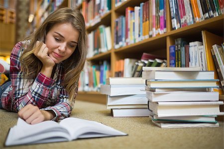 simsearch:400-07141917,k - Young happy student lying on library floor reading book in college Stock Photo - Budget Royalty-Free & Subscription, Code: 400-07267508