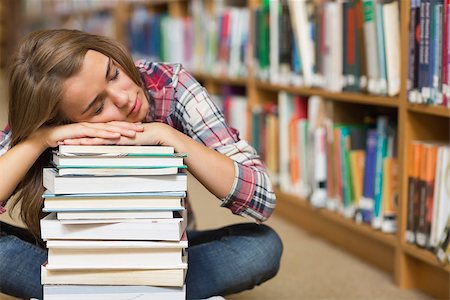 simsearch:400-07141917,k - Sleeping student sitting on library floor leaning on pile of books in college Stock Photo - Budget Royalty-Free & Subscription, Code: 400-07267545