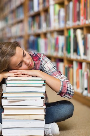 simsearch:400-07141917,k - Napping student sitting on library floor leaning on pile of books in college Stock Photo - Budget Royalty-Free & Subscription, Code: 400-07267547