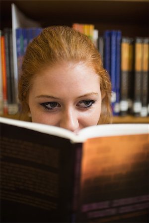 simsearch:400-07267769,k - Redhead student reading a book at the university Stock Photo - Budget Royalty-Free & Subscription, Code: 400-07267608