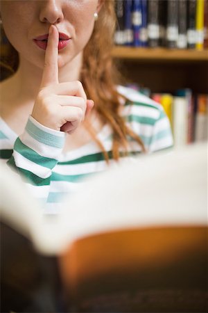 simsearch:400-07267769,k - Student asking for silence holding a book at the university Stock Photo - Budget Royalty-Free & Subscription, Code: 400-07267611