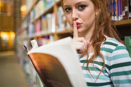 simsearch:400-07267769,k - Serious student asking for silence holding a book at the university Stock Photo - Budget Royalty-Free & Subscription, Code: 400-07267613