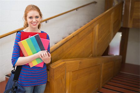simsearch:400-07267769,k - Student standing on the stairs smiling at camera at the university Stock Photo - Budget Royalty-Free & Subscription, Code: 400-07267705
