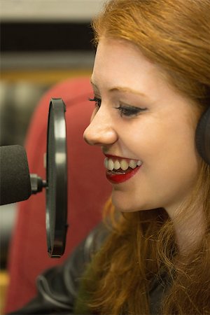 Pretty redhead student presenting a radio show in college Stock Photo - Budget Royalty-Free & Subscription, Code: 400-07267724