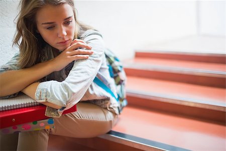 simsearch:400-07267769,k - Sad lonely student sitting on stairs in college Stock Photo - Budget Royalty-Free & Subscription, Code: 400-07267767