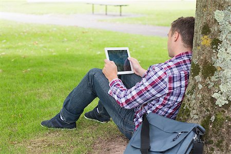 students tablets outside - Student using his tablet pc outside  on college campus Stock Photo - Budget Royalty-Free & Subscription, Code: 400-07267790