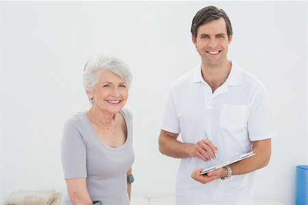 disabled women on crutches - Portrait of a smiling male therapist and disabled senior patient in the gym at hospital Stock Photo - Budget Royalty-Free & Subscription, Code: 400-07267865