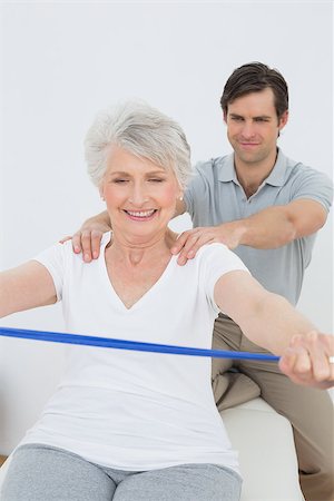 Male therapist assisting senior woman with exercises in the medical office Stock Photo - Budget Royalty-Free & Subscription, Code: 400-07267928