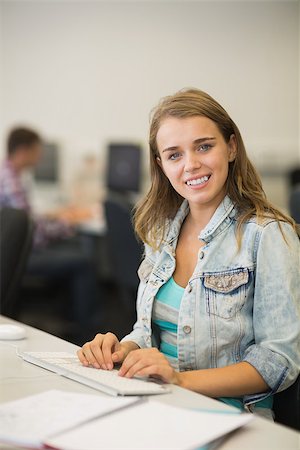 simsearch:400-07267978,k - Happy young student studying in the computer room in college Stock Photo - Budget Royalty-Free & Subscription, Code: 400-07267957