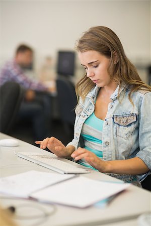 simsearch:400-07267978,k - Focused pretty student working in the computer room in college Stock Photo - Budget Royalty-Free & Subscription, Code: 400-07267950