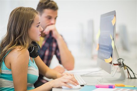 simsearch:400-07267978,k - Classmates doing an assignment together in the computer room in college Stock Photo - Budget Royalty-Free & Subscription, Code: 400-07267992