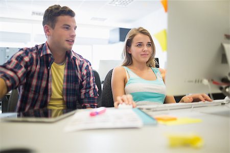 simsearch:400-07267978,k - Happy students working together in the computer room in college Stock Photo - Budget Royalty-Free & Subscription, Code: 400-07268010