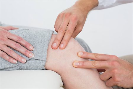 Close-up mid section of a woman getting her knee examined at the medical office Stock Photo - Budget Royalty-Free & Subscription, Code: 400-07268038