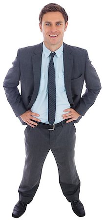 simsearch:693-03301185,k - Cheerful businessman standing with hands on hips on white background Stock Photo - Budget Royalty-Free & Subscription, Code: 400-07268104