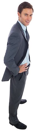 simsearch:400-06885881,k - Cheerful businessman standing with hands on hips on white background Photographie de stock - Aubaine LD & Abonnement, Code: 400-07268109