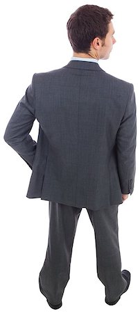 simsearch:400-06885881,k - Businessman standing with hand on hip on white background Photographie de stock - Aubaine LD & Abonnement, Code: 400-07268113