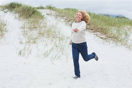 simsearch:400-07267212,k - Full length of a happy senior woman running at the beach Stockbilder - Microstock & Abonnement, Bildnummer: 400-07268524