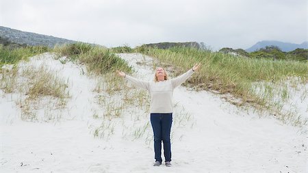 simsearch:6109-07496983,k - Full length of a senior woman with arms outstretched standing at the beach Stock Photo - Budget Royalty-Free & Subscription, Code: 400-07268527