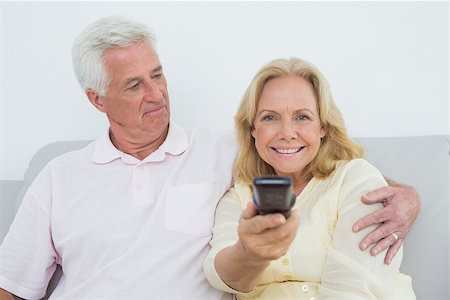 simsearch:400-04046300,k - Relaxed senior couple watching television in a house Stock Photo - Budget Royalty-Free & Subscription, Code: 400-07268892