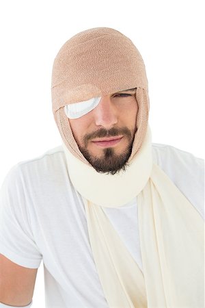 simsearch:400-04255649,k - Close-up portrait of a young man with head tied up in bandage over  white background Foto de stock - Royalty-Free Super Valor e Assinatura, Número: 400-07269922