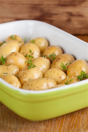 simsearch:400-05320343,k - Baby potatoes with thyme, olive oil and salt on baking sheet Stock Photo - Budget Royalty-Free & Subscription, Code: 400-07261302