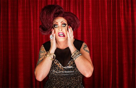 simsearch:400-07261849,k - Uncertain drag queen with hands on face Fotografie stock - Microstock e Abbonamento, Codice: 400-07261813